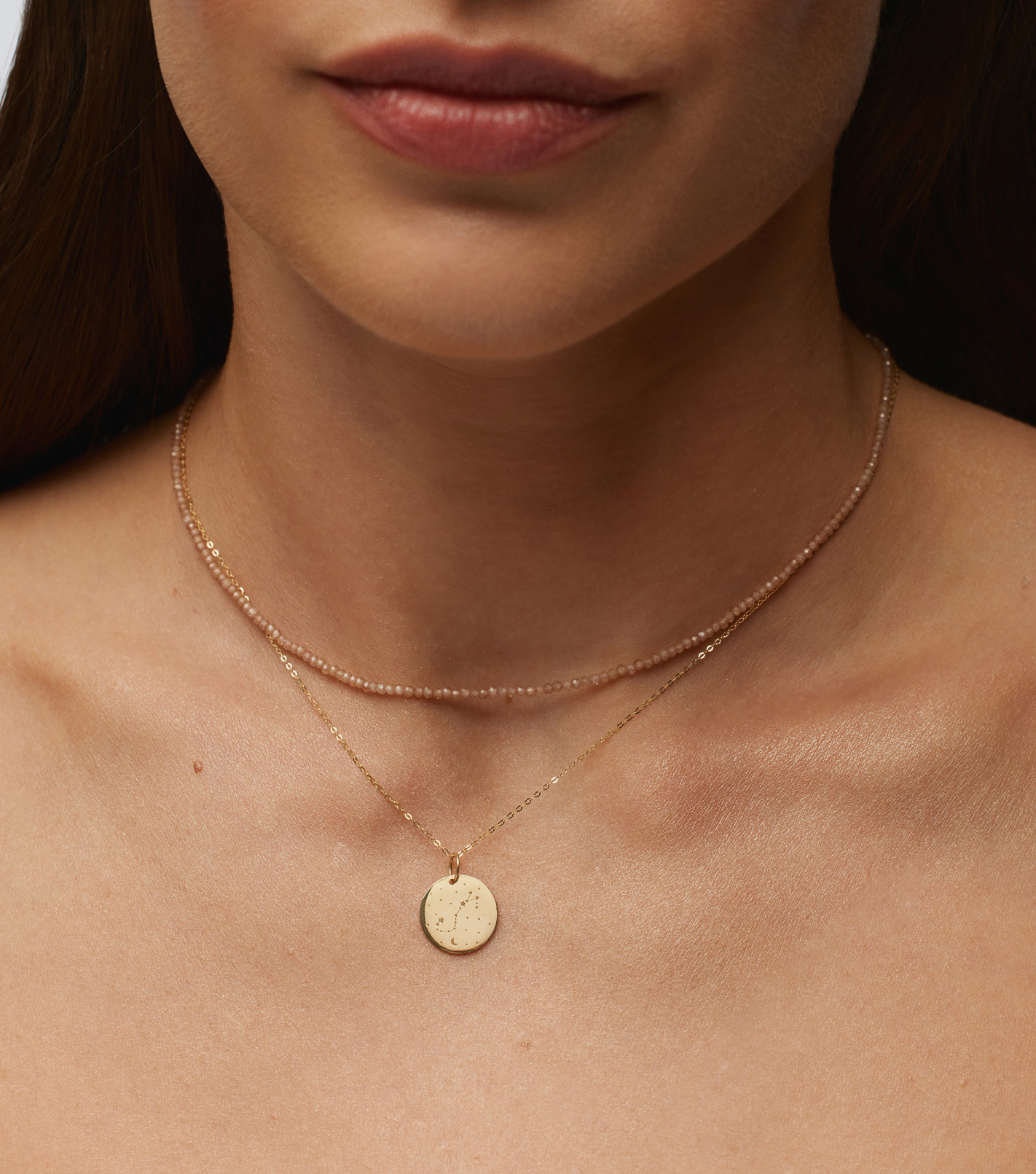 Złoty łańcuszek ze znakiem zodiaku
